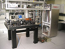  A laboratory table with some optical devices on it.