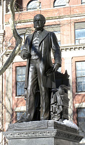 Bronze statue of a man in a city park