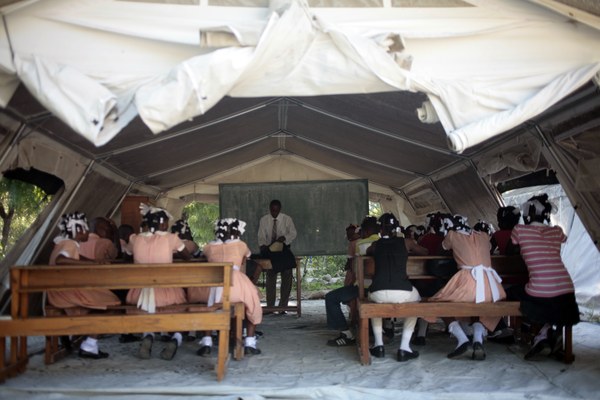 Pupils attend lessons in an SOS tent 