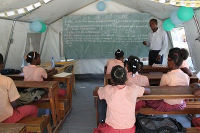 Teaching a secondary class in a tent at the SOS School Santo