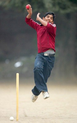 A boy from Pakistan playing cricket