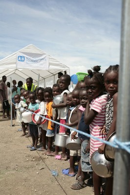 Boys and girls waiting for a meal at an SOS food distribution point, Port-au-Prince 