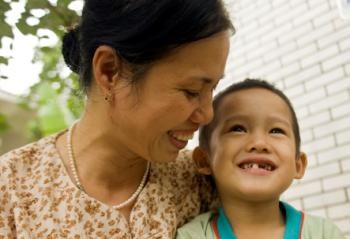 Mother and boy smiling, Vietnam