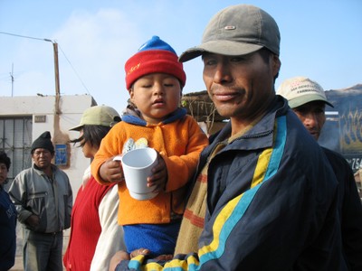 Child and father affected by earthquake Peru Autumn 2008