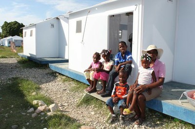 An SOS Auntie with her 5 children outside her temporary home, Santo