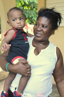 An SOS mother holds her baby at SOS Children's Village Santo