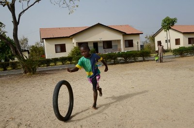 Basse boy w village view